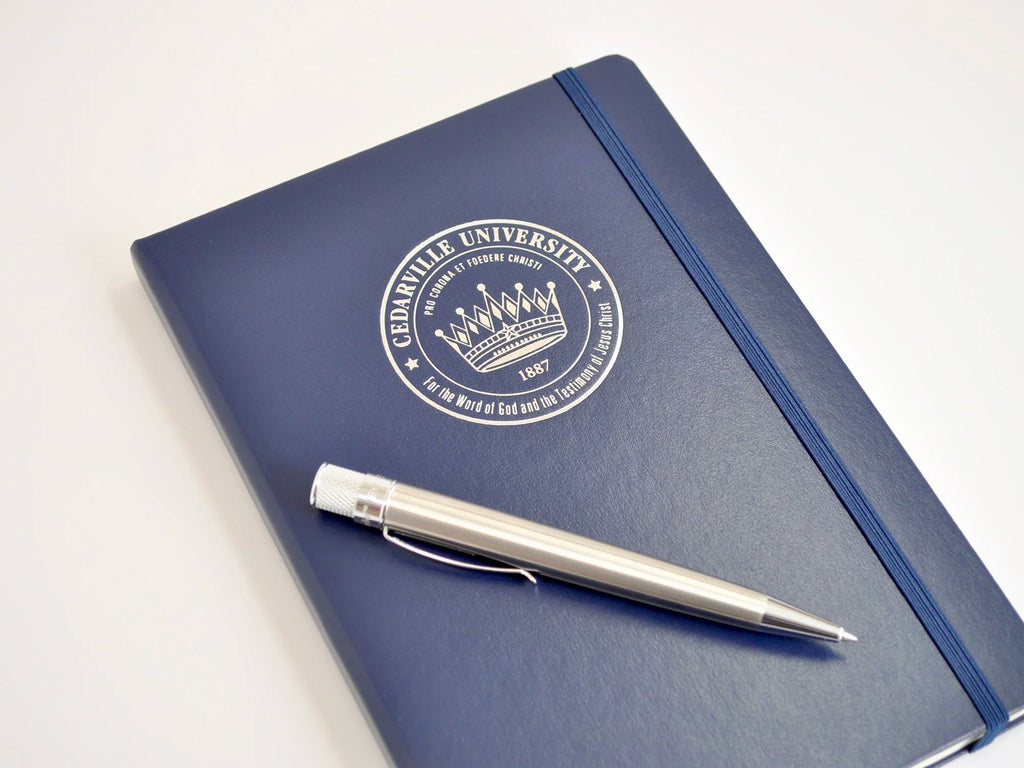 Silver Logo on Navy Blue Notebook